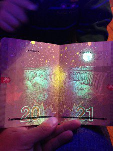Canadian passport under blacklight